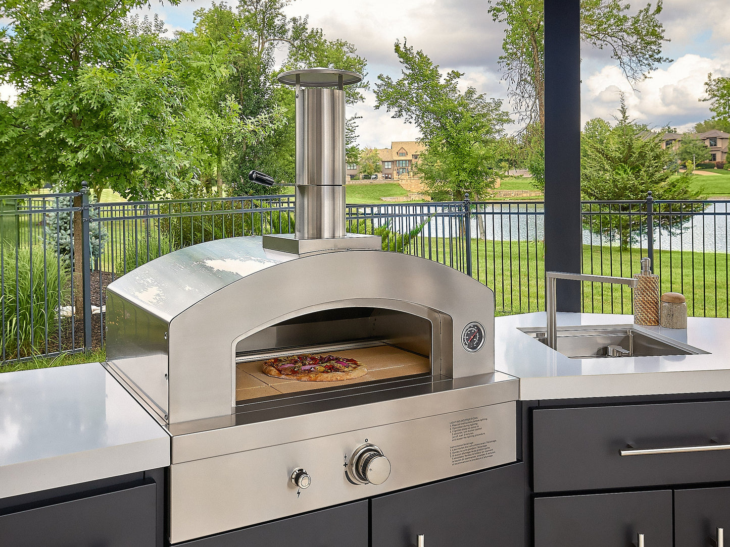 Edgemont Cove | Curved Outdoor Kitchen with Built-In Grill, Griddle & Pizza Oven